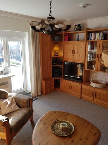 a living room with a couch and a coffee table at Seestern in Hörnum