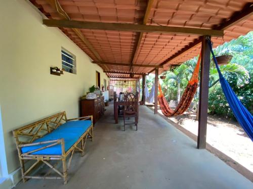 a porch with a swing and a hammock at Casa da Marluce in Fernando de Noronha