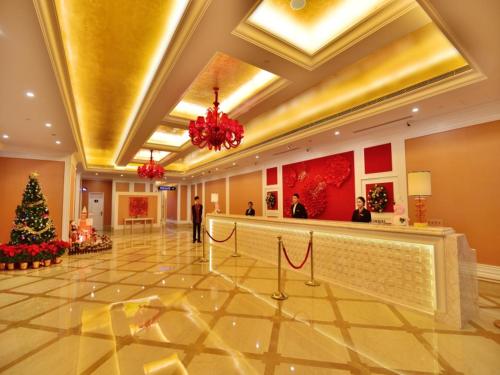 a lobby of a hotel with a christmas tree at Similan Hotel Zhuhai-Gongbei Port in Zhuhai