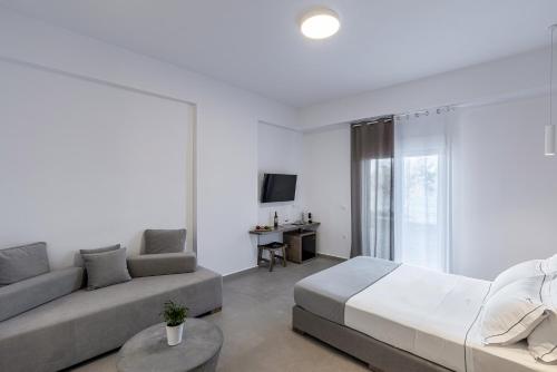 a living room with a bed and a couch at Vivianna's View in Azolimnos