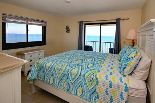 a bedroom with a bed with a view of the ocean at Myrtle Beach Resort T1601 in Myrtle Beach