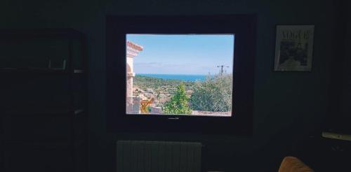 a window in a room with a view of the ocean at Villa Alba Sul Mare in Budoni