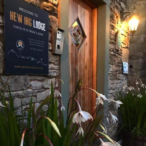 a welcome door to a new inn lodge at New Ing Lodge in Shap