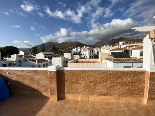 a view of a city from the roof of a building at El ático de la Cañada in Frigiliana