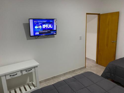 a living room with a tv on a wall at Don Benja in Federación