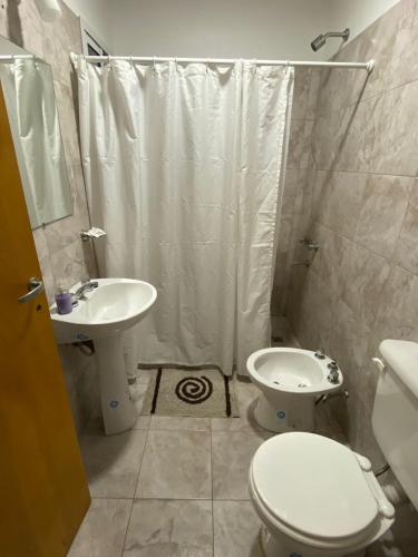 a bathroom with a toilet and a sink and a shower at Don Benja in Federación