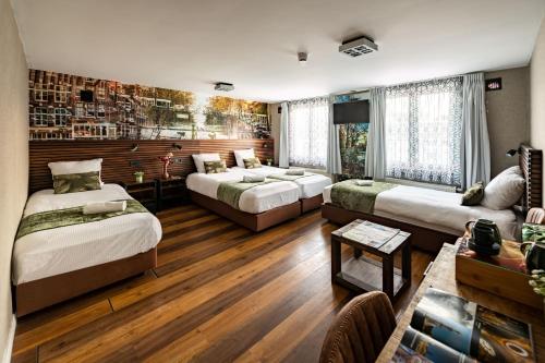 Postel nebo postele na pokoji v ubytování Historic Centre Hotel