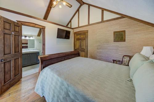 a bedroom with a large bed and a bathroom at Halpino in Vicksburg