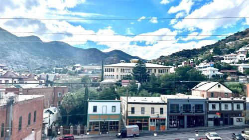 a view of a city with mountains in the background at Hotel La More at The Bisbee Inn in Bisbee