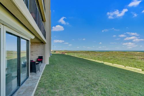 a side view of a house with a lawn at Sea Vista in South Padre Island