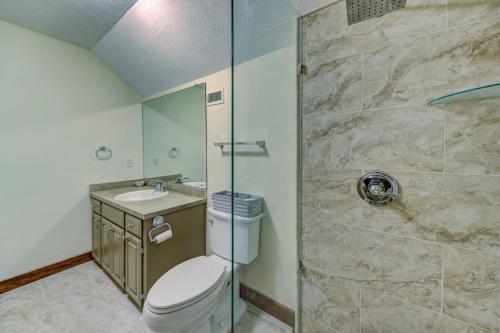 a bathroom with a shower and a toilet and a sink at Halpino in Vicksburg