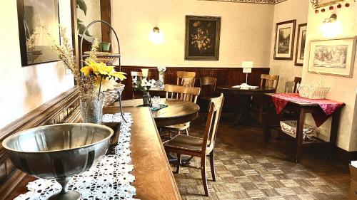 a room with a table and a bowlasteryasteryasteryasteryasteryasteryasteryastery at Hotel La More at The Bisbee Inn in Bisbee
