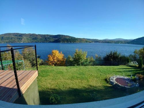 a view of a view of a lake from a deck at Bergen Sunrise Terrace Apartment in Bergen