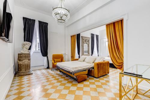 a bedroom with a bed and a table and a television at NEW!! SPAGNA Suite - Your Italian Holidays in Rome