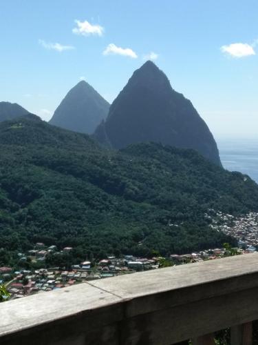 a view of mountains with a town and a city at Desired View in Choiseul