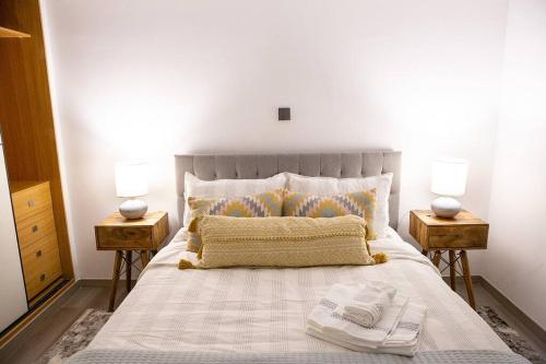 Voodi või voodid majutusasutuse Nairobi Condo with a View toas