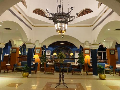 a lobby of a hotel with a chandelier at Aida Hotel Sharm El Sheikh in Sharm El Sheikh