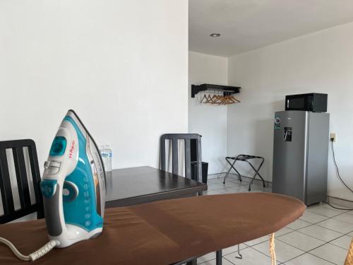 a iron sitting on top of a table in a kitchen at Hotel La Quinta Bonita in Ensenada