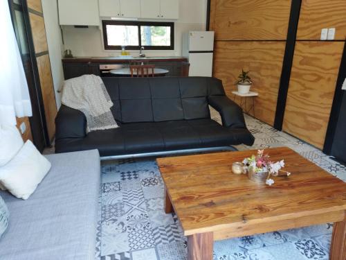 a living room with a couch and a coffee table at Apartamento Dos hermanas in Colonia Estrella