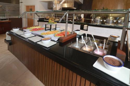 a buffet line with many different types of food at Holiday Inn Tuxpan - Convention Center by IHG in Tuxpan de Rodríguez Cano