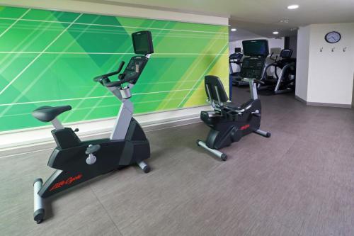 a gym with three exercise bikes in a room at Holiday Inn Tuxpan - Convention Center by IHG in Tuxpan de Rodríguez Cano