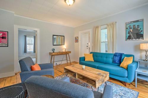 a living room with a blue couch and chairs at Updated Vintage Apartment Less Than half Mi to Main St in Keene