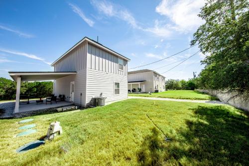 a house with a large yard in front of it at Lakeshore Retreat in Canyon Lake