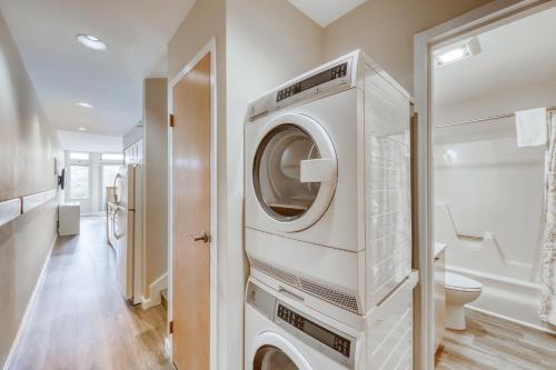 a washer and dryer in a bathroom with a toilet at Village Gate Unit 209 in Warren