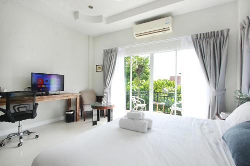 TV a/nebo společenská místnost v ubytování The Langstan Suites