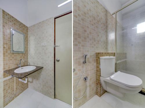 a bathroom with a toilet and a sink and a shower at Destino By INR Suites in Hyderabad