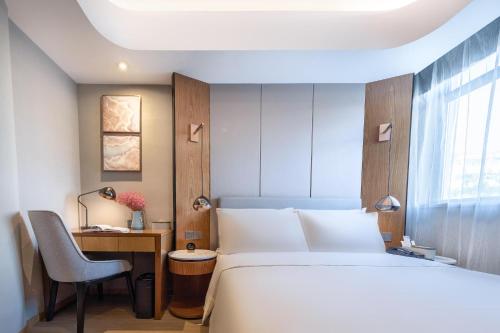 Postel nebo postele na pokoji v ubytování Atour X Hotel Yantai Penglai Pavilion