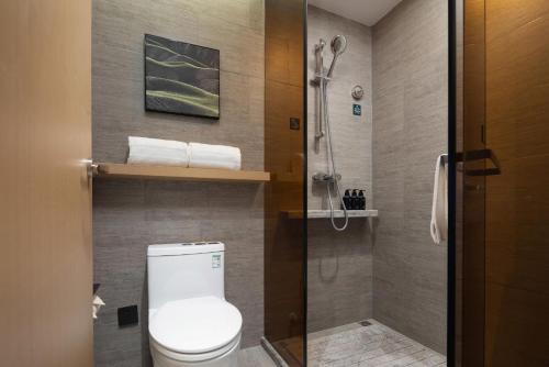 a bathroom with a toilet and a shower at Atour Hotel Zezhou Road Jincheng in Jincheng