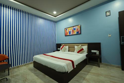 Ένα ή περισσότερα κρεβάτια σε δωμάτιο στο Hotel Jai Harsh