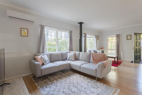 a living room with a couch and a rug at Nilgiri 3BR Mountain Retreat 5mins Katoomba Centre in Katoomba