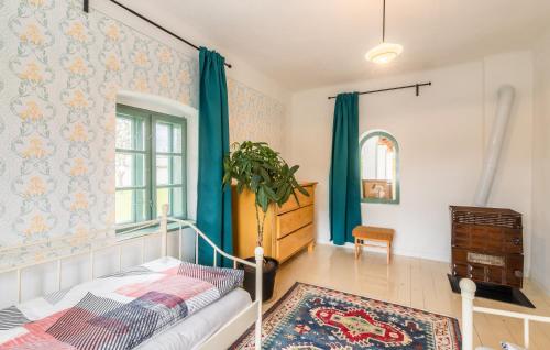 a bedroom with a bed and a dresser and a window at Nálunk, vidéken - Cottage 54 in Ásványráró