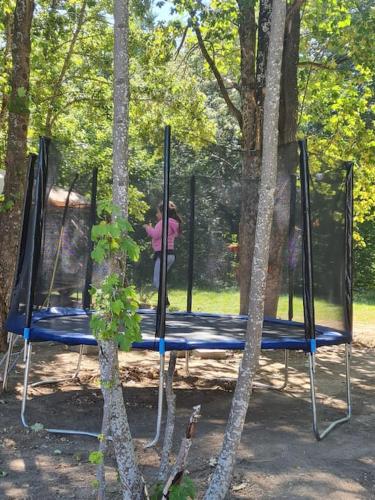 a person playing on a swing set in a park at Вила Вайлин in Batak
