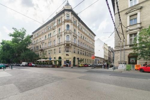 a large building on a street in front of a building at Broadway Residence in Budapest