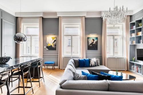 a living room with a couch and a table at Broadway Residence in Budapest