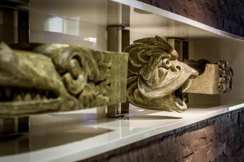 a sculpture of a lion on a shelf in a museum at Mercure Gdańsk Stare Miasto in Gdańsk