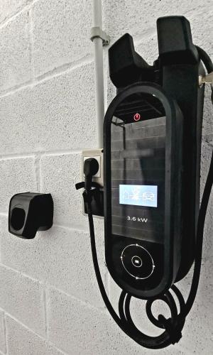 a pay phone is attached to a wall at Suite Haus Vargas in Santander