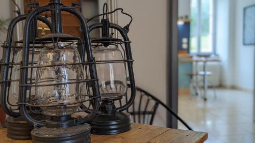 a lantern sitting on top of a table at Le Moulin de la Motte - 12 personnes in Bellenot-sous-Pouilly