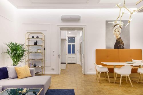 a living room with a couch and a table at Broadway Residence in Budapest