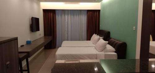 En eller flere senge i et værelse på Studio Suite Genting Highland 13A