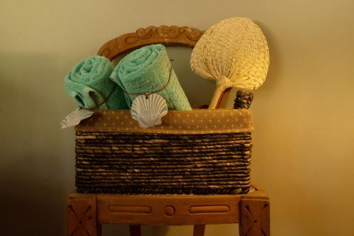 a basket with yarn and a mirror on a table at Luna Laguna in Kalpitiya