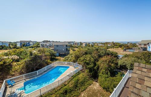 an overhead view of a swimming pool at a house at Sound Waves in Duck