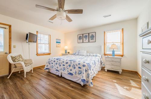 a bedroom with a bed and a ceiling fan at Sound Waves in Duck