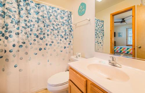 a bathroom with a sink and a toilet and a shower at Sound Waves in Duck