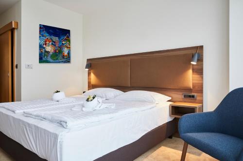 Postel nebo postele na pokoji v ubytování Thermal Resort Hotel Lendava