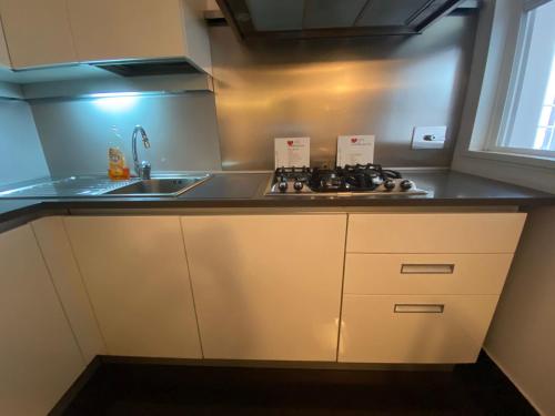 A kitchen or kitchenette at San Giovanni Lovely Loft
