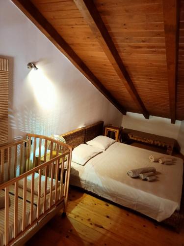 a bedroom with a bed and a crib at Sal&Love apt in Porto Antigo in Santa Maria